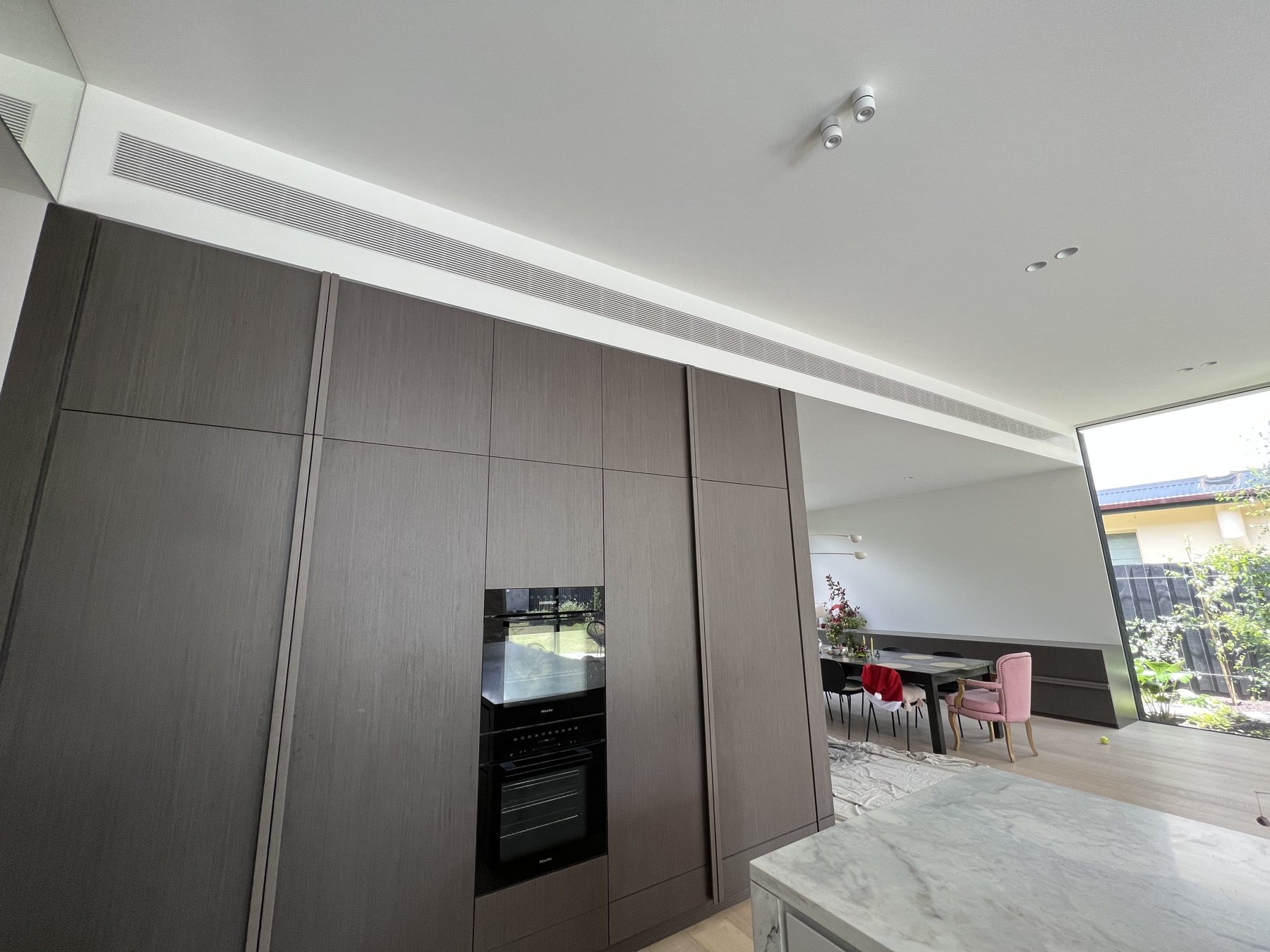 Ducted outlet serving an open-plan kitchen and living area